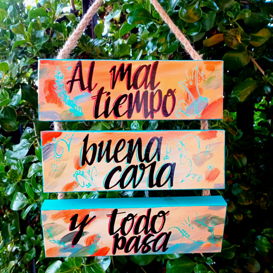 AL MAL TIEMPO, BUENA CARA - COLGANTE